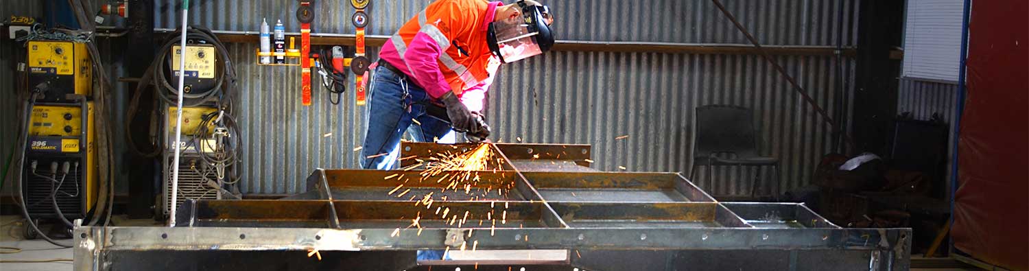 Worker using grinding tool