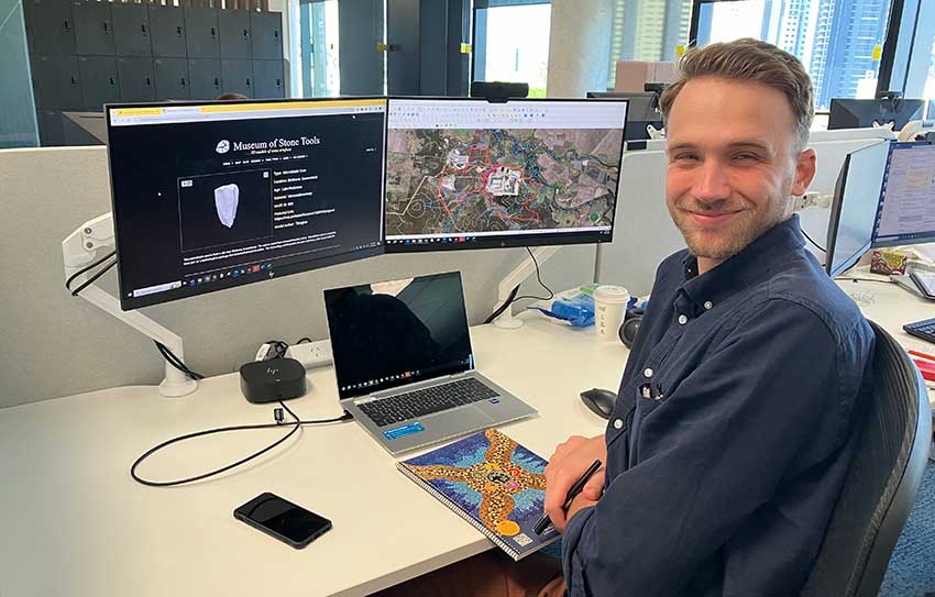 Andrew Binyon at his desk 850w